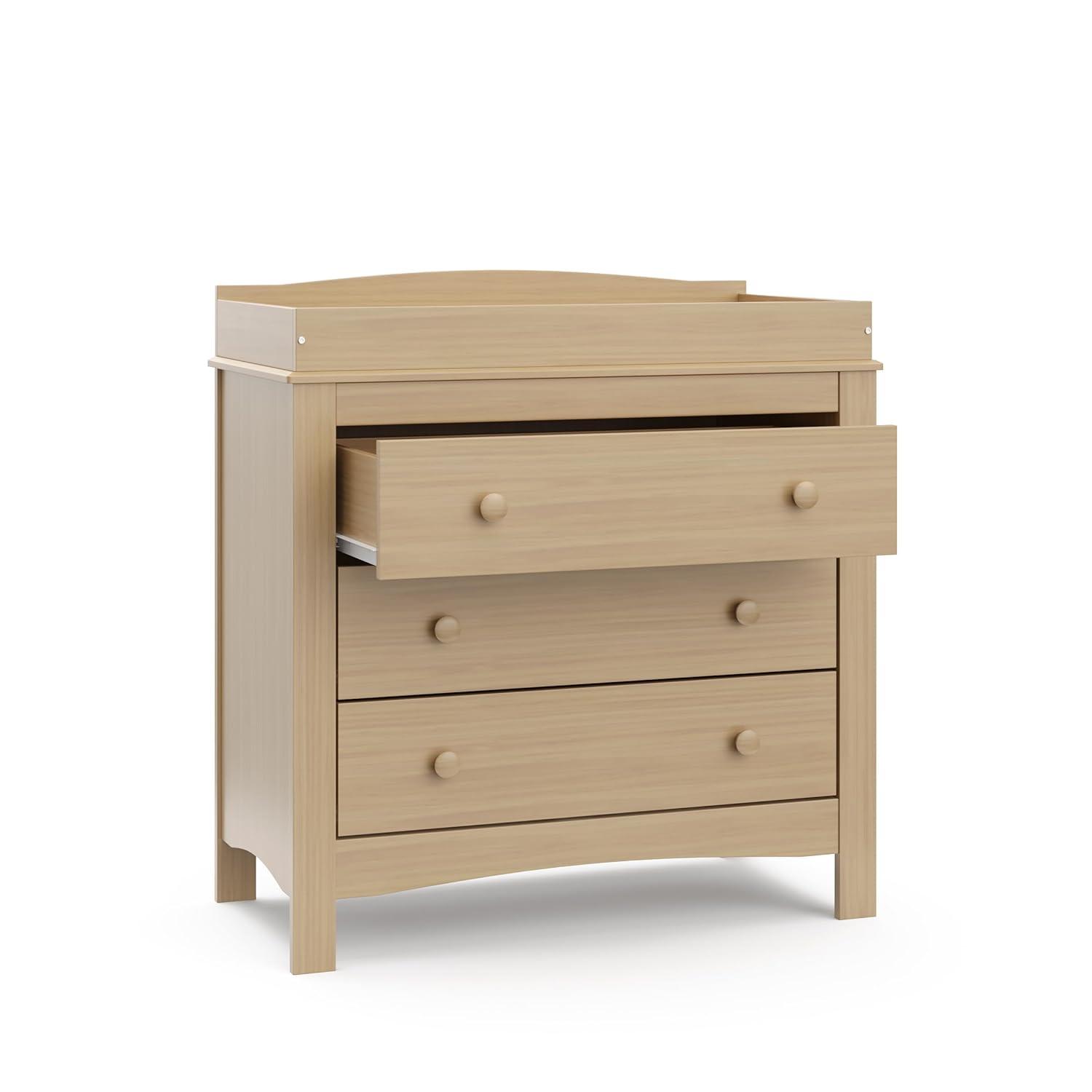 imageGraco Noah 3 Drawer Chest with Changing Topper Pebble Gray GREENGUARD Gold Certified Baby Dresser Table Top for Nursery KidsDriftwood