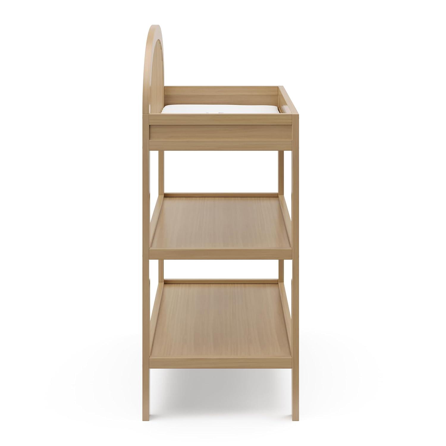 imageGraco Olivia Changing Table with WaterResistant Changing Pad Driftwood GREENGUARD Gold Certified Includes Bonus WaterResistant Changing Pad with Safety Strap 2 Open Shelves Stylish DesignDriftwood