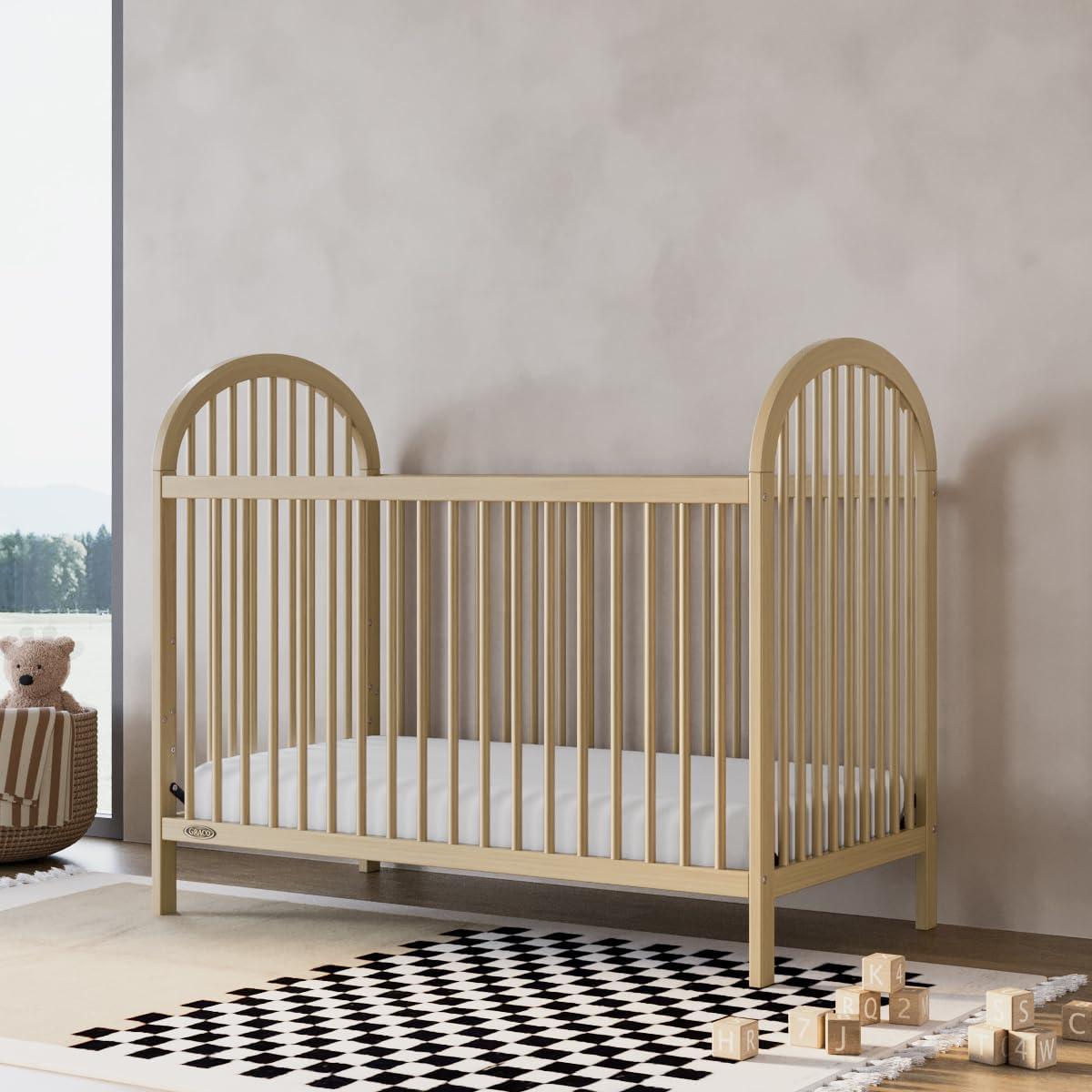 imageGraco Olivia Convertible Crib Black GREENGUARD Gold Certified 100 Solid Wood Fits Standard Crib Mattress Converts to Toddler Bed and Daybed 4 Adjustable Mattress HeightsDriftwood