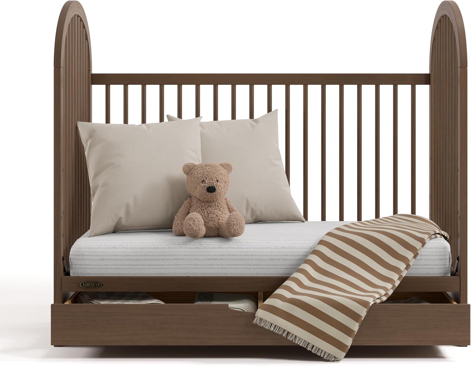 imageGraco Olivia Convertible Crib Black GREENGUARD Gold Certified 100 Solid Wood Fits Standard Crib Mattress Converts to Toddler Bed and Daybed 4 Adjustable Mattress HeightsHazelnut