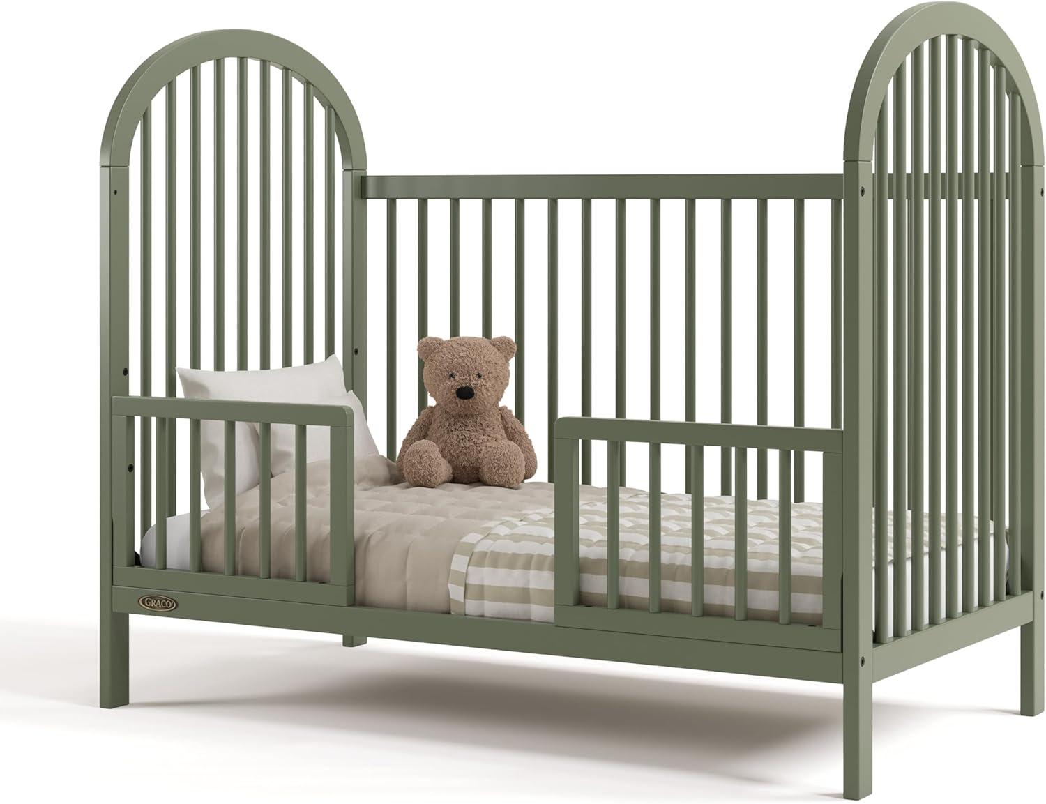 imageGraco Olivia Convertible Crib Black GREENGUARD Gold Certified 100 Solid Wood Fits Standard Crib Mattress Converts to Toddler Bed and Daybed 4 Adjustable Mattress HeightsOlive
