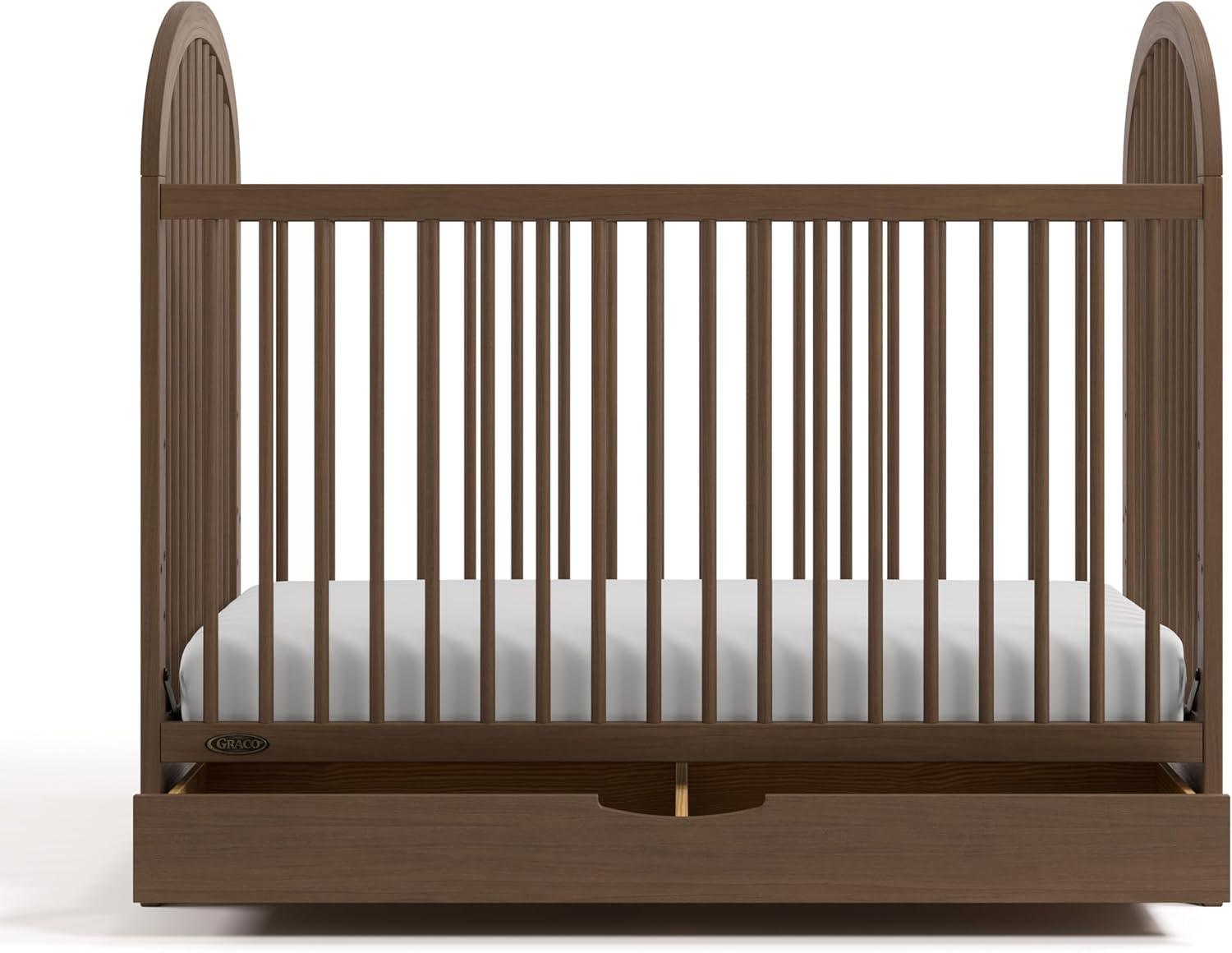 imageGraco Olivia Convertible Crib Black GREENGUARD Gold Certified 100 Solid Wood Fits Standard Crib Mattress Converts to Toddler Bed and Daybed 4 Adjustable Mattress HeightsHazelnut