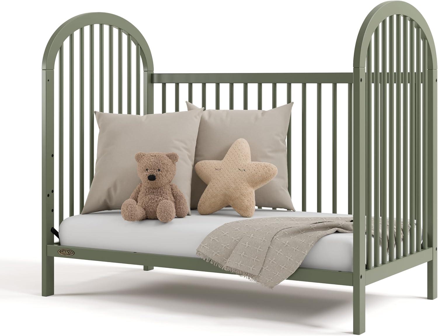 imageGraco Olivia Convertible Crib Black GREENGUARD Gold Certified 100 Solid Wood Fits Standard Crib Mattress Converts to Toddler Bed and Daybed 4 Adjustable Mattress HeightsOlive