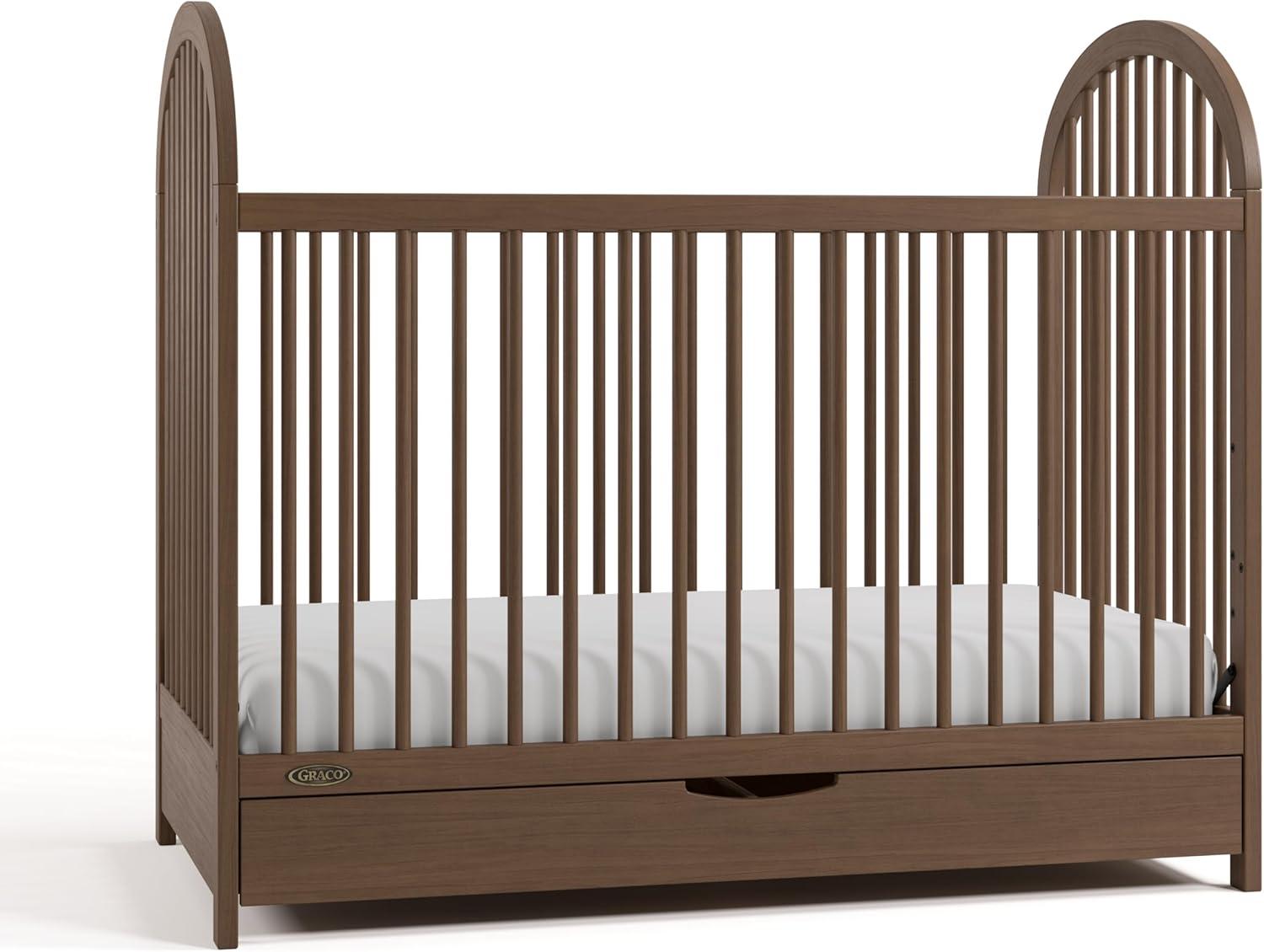 imageGraco Olivia Convertible Crib Black GREENGUARD Gold Certified 100 Solid Wood Fits Standard Crib Mattress Converts to Toddler Bed and Daybed 4 Adjustable Mattress HeightsHazelnut
