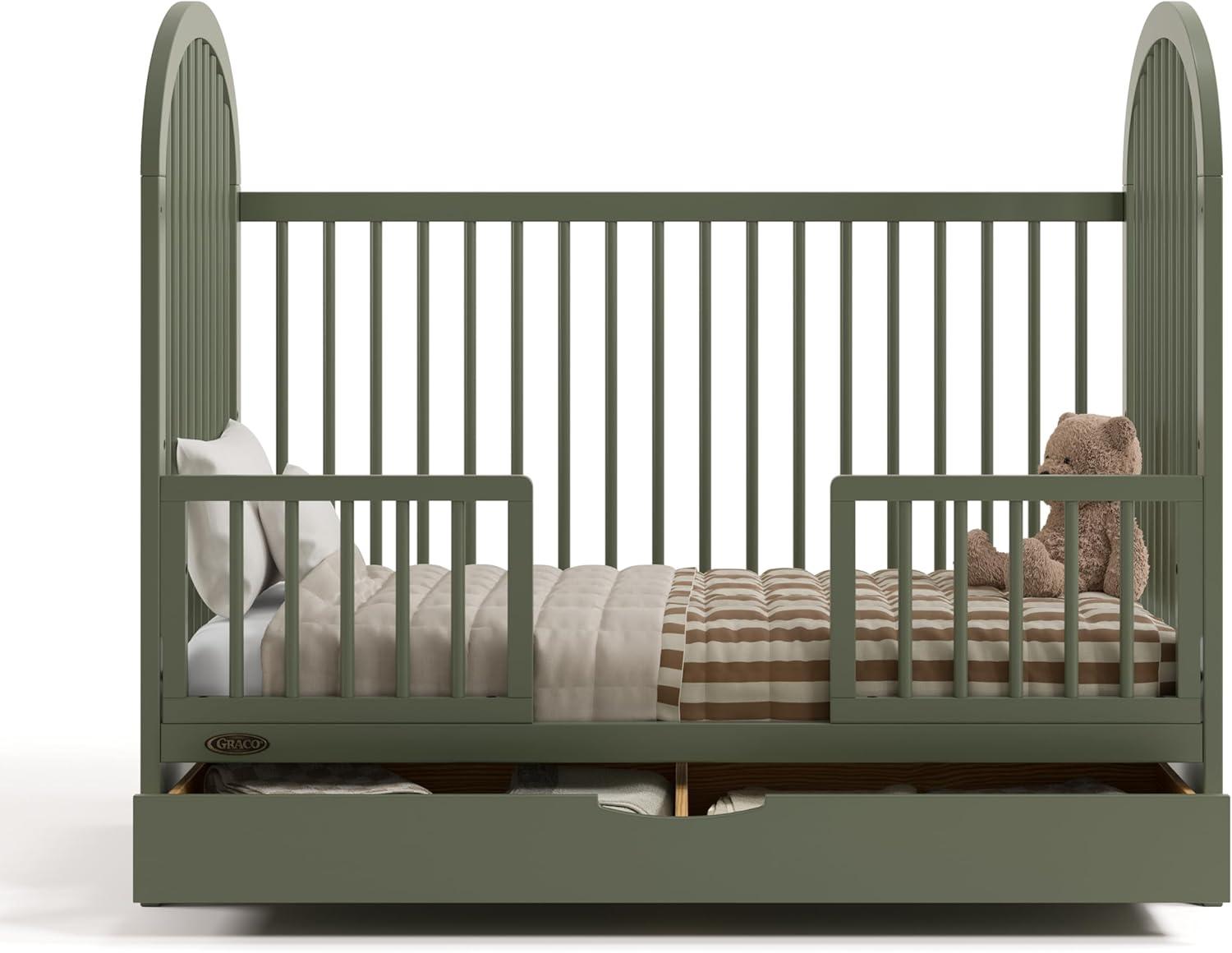 imageGraco Olivia Convertible Crib Black GREENGUARD Gold Certified 100 Solid Wood Fits Standard Crib Mattress Converts to Toddler Bed and Daybed 4 Adjustable Mattress HeightsOlive