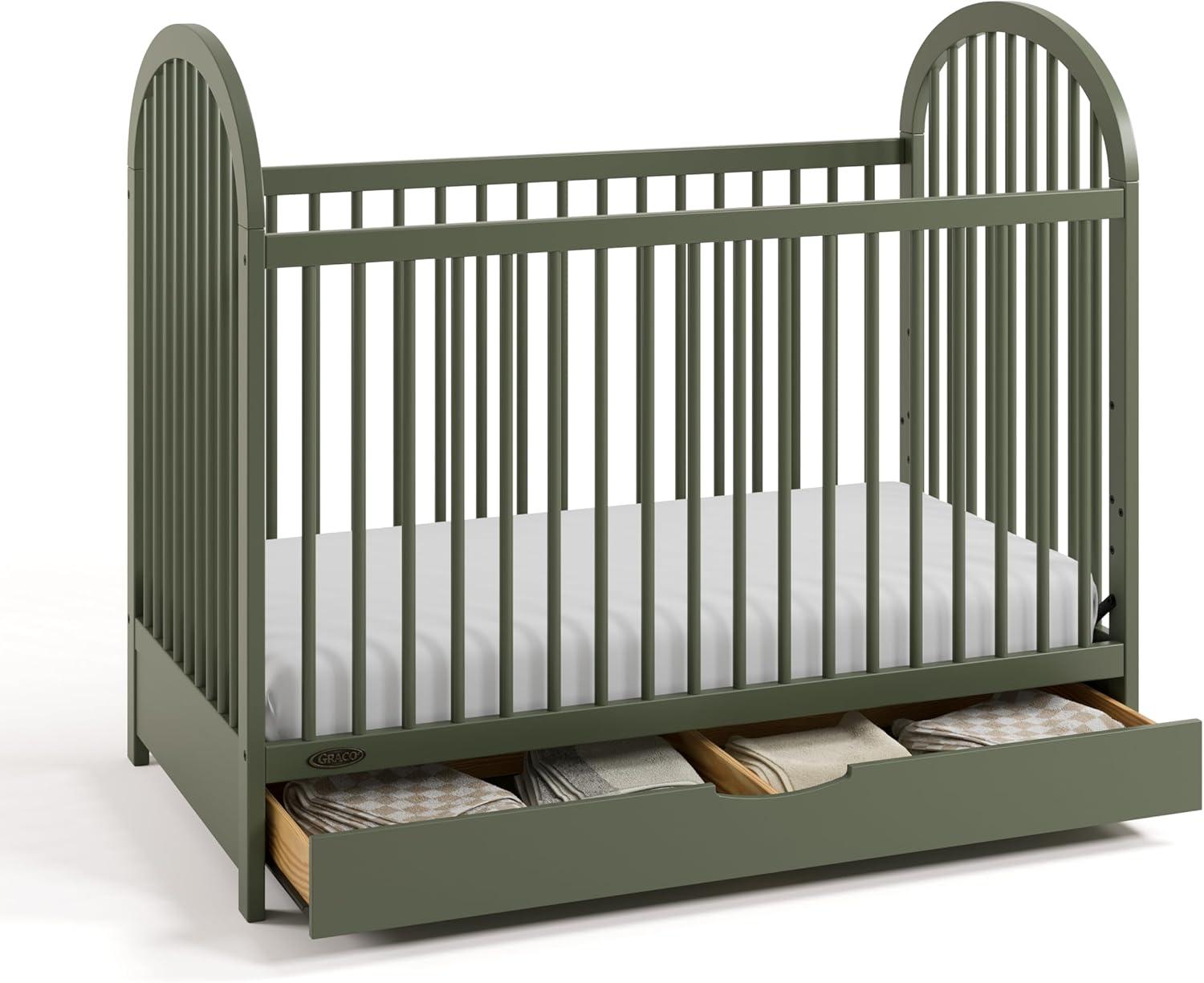 imageGraco Olivia Convertible Crib Black GREENGUARD Gold Certified 100 Solid Wood Fits Standard Crib Mattress Converts to Toddler Bed and Daybed 4 Adjustable Mattress HeightsOlive