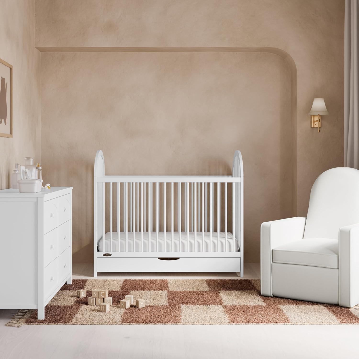 imageGraco Olivia Convertible Crib Black GREENGUARD Gold Certified 100 Solid Wood Fits Standard Crib Mattress Converts to Toddler Bed and Daybed 4 Adjustable Mattress HeightsWhite