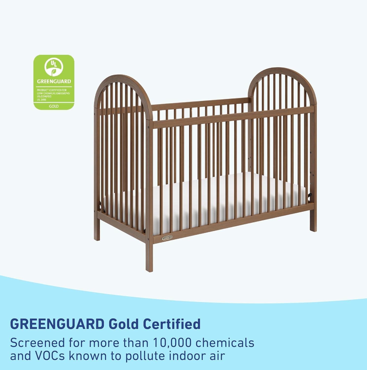 imageGraco Olivia Convertible Crib Black GREENGUARD Gold Certified 100 Solid Wood Fits Standard Crib Mattress Converts to Toddler Bed and Daybed 4 Adjustable Mattress HeightsHazelnut