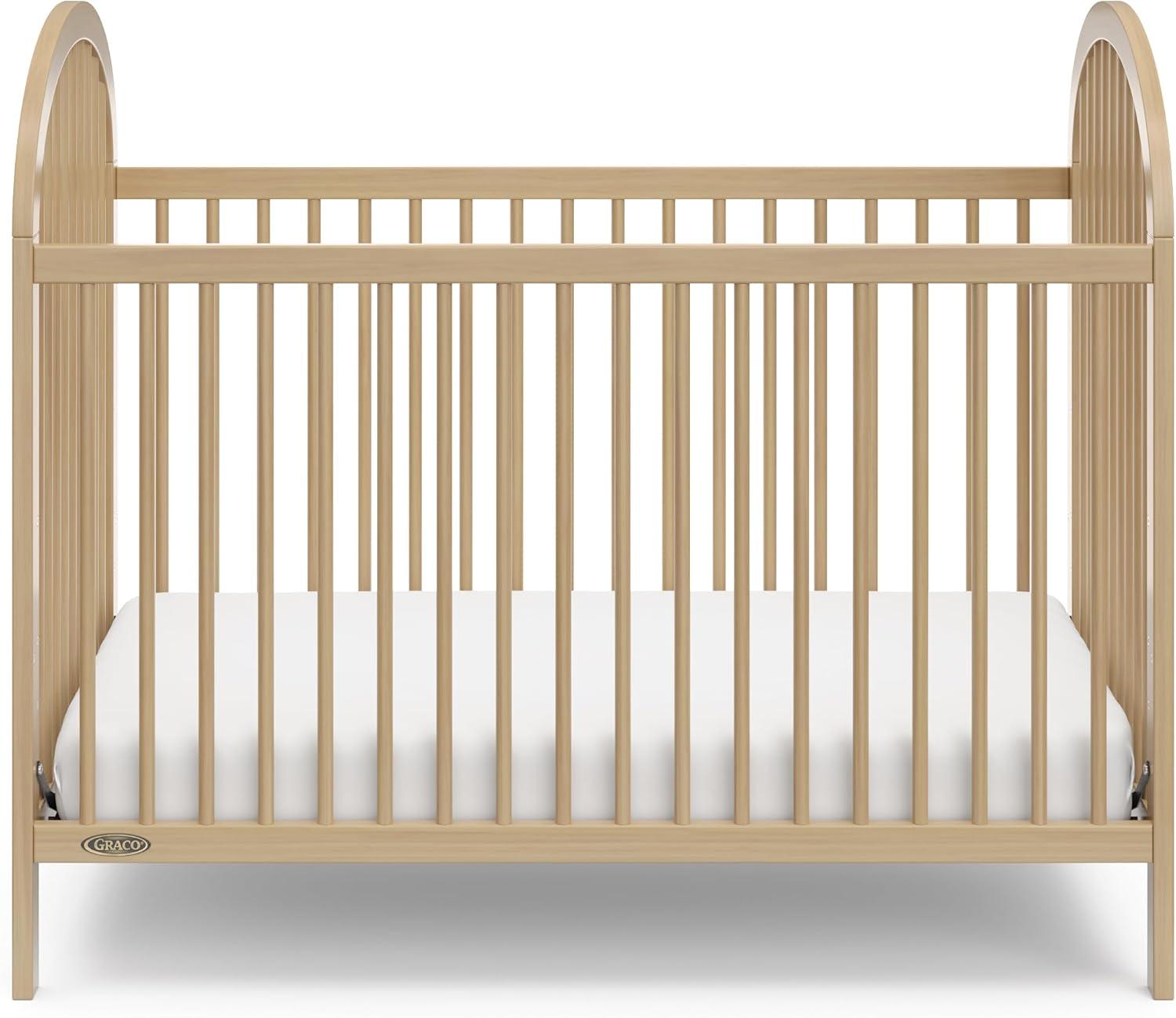 imageGraco Olivia Convertible Crib Hazelnut GREENGUARD Gold Certified 100 Solid Wood Fits Standard Crib Mattress Converts to Toddler Bed and Daybed 4 Adjustable Mattress HeightsDriftwood