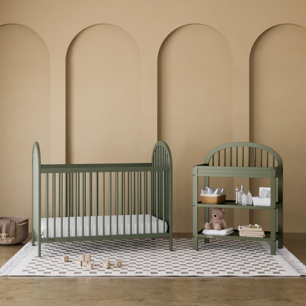 imageGraco Olivia Convertible Crib Hazelnut GREENGUARD Gold Certified 100 Solid Wood Fits Standard Crib Mattress Converts to Toddler Bed and Daybed 4 Adjustable Mattress HeightsOlive
