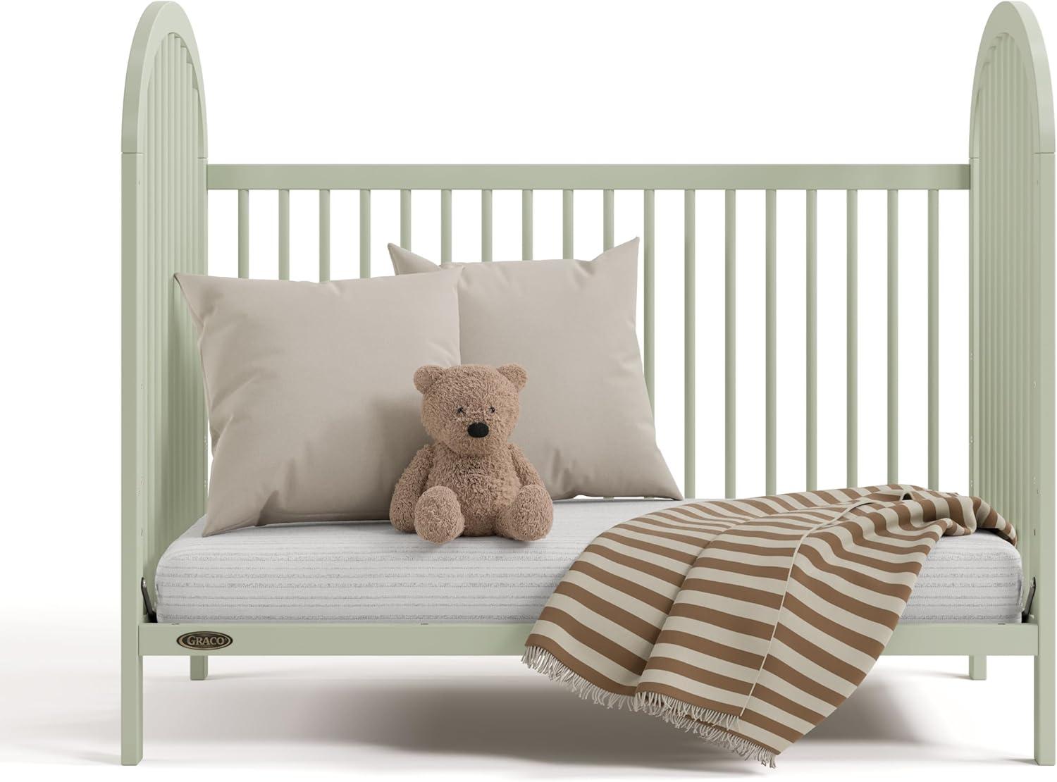 imageGraco Olivia Convertible Crib Hazelnut GREENGUARD Gold Certified 100 Solid Wood Fits Standard Crib Mattress Converts to Toddler Bed and Daybed 4 Adjustable Mattress HeightsSage