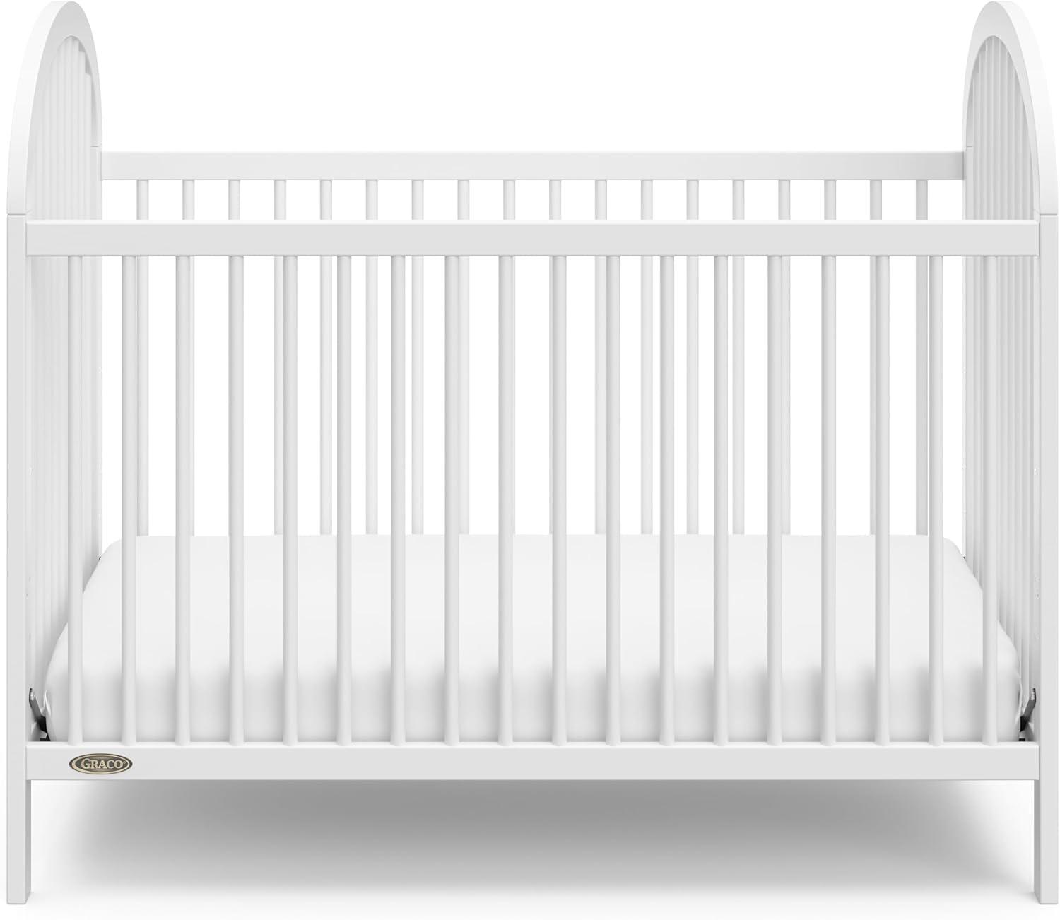 imageGraco Olivia Convertible Crib Hazelnut GREENGUARD Gold Certified 100 Solid Wood Fits Standard Crib Mattress Converts to Toddler Bed and Daybed 4 Adjustable Mattress HeightsWhite