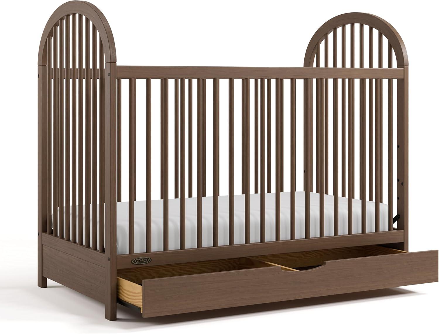 imageGraco Olivia Convertible Crib Hazelnut GREENGUARD Gold Certified 100 Solid Wood Fits Standard Crib Mattress Converts to Toddler Bed and Daybed 4 Adjustable Mattress HeightsHazelnut