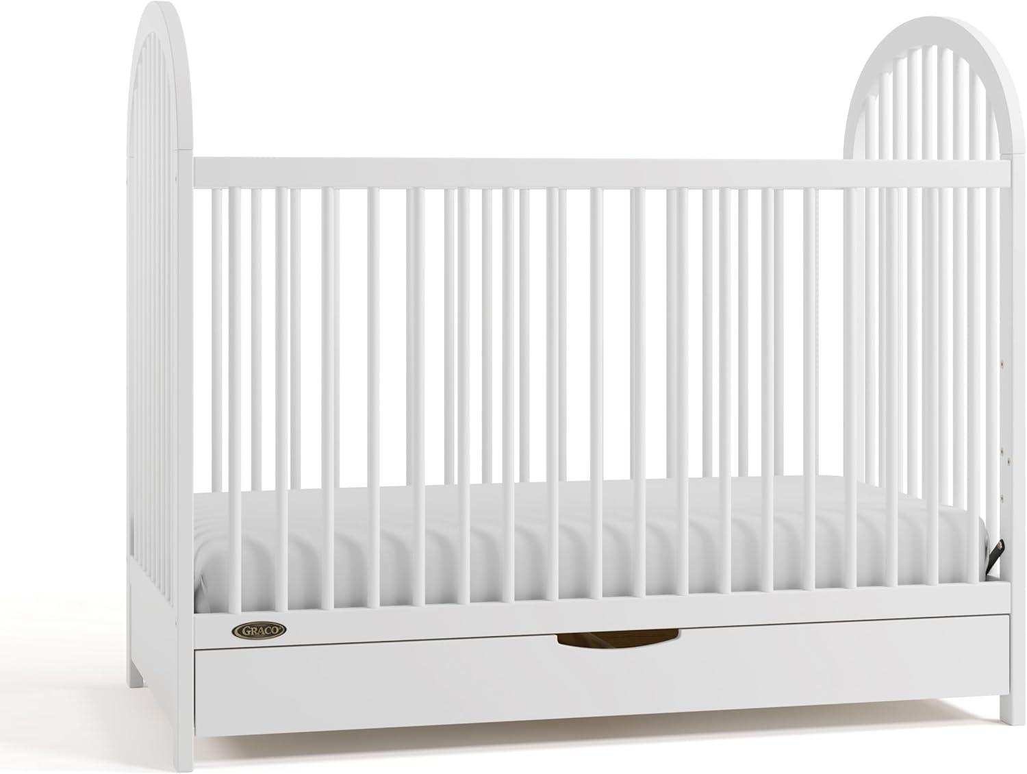 imageGraco Olivia Convertible Crib Hazelnut GREENGUARD Gold Certified 100 Solid Wood Fits Standard Crib Mattress Converts to Toddler Bed and Daybed 4 Adjustable Mattress HeightsWhite
