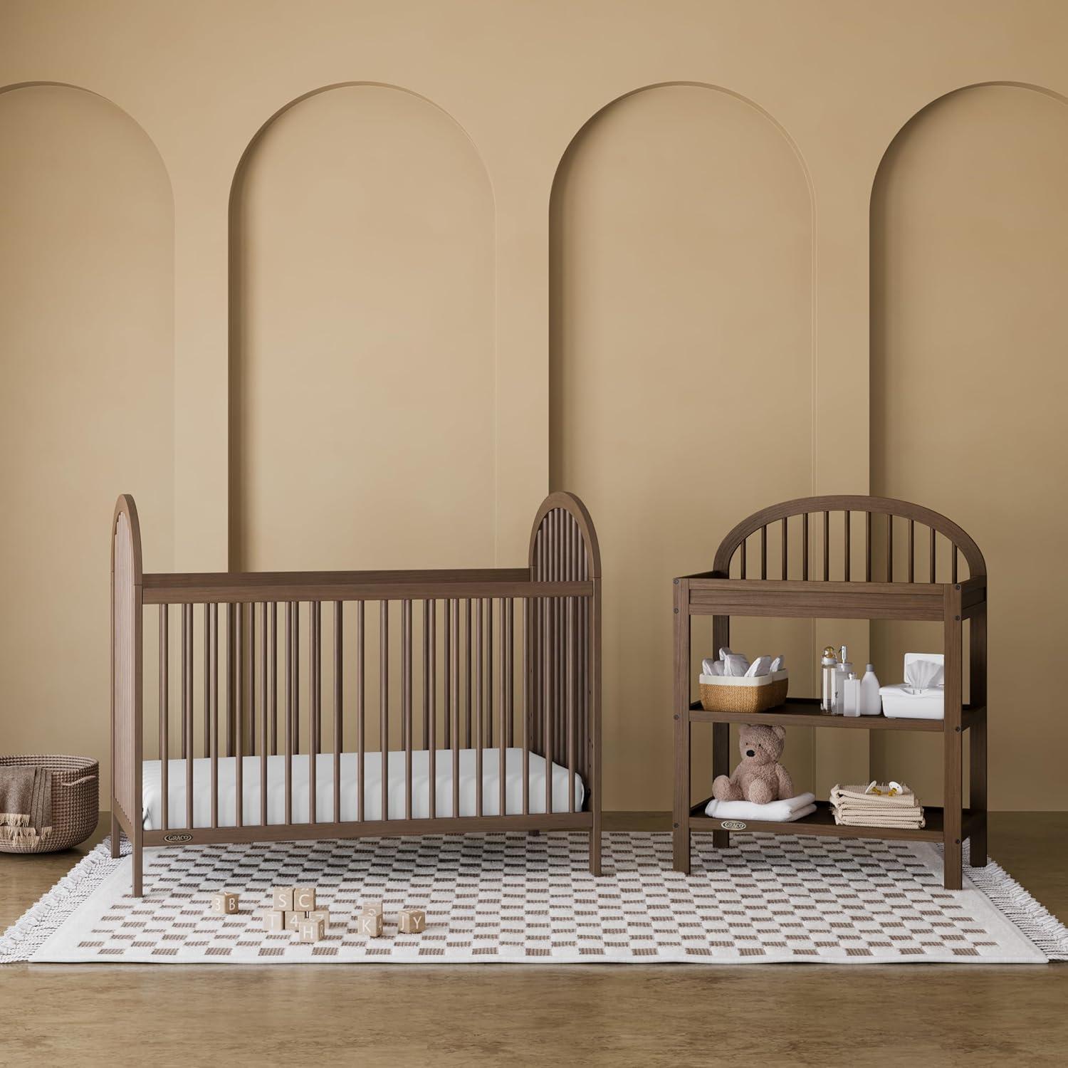 imageGraco Olivia Convertible Crib Hazelnut GREENGUARD Gold Certified 100 Solid Wood Fits Standard Crib Mattress Converts to Toddler Bed and Daybed 4 Adjustable Mattress HeightsHazelnut