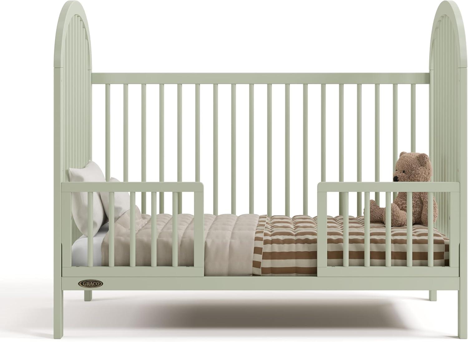 imageGraco Olivia Convertible Crib Hazelnut GREENGUARD Gold Certified 100 Solid Wood Fits Standard Crib Mattress Converts to Toddler Bed and Daybed 4 Adjustable Mattress HeightsSage
