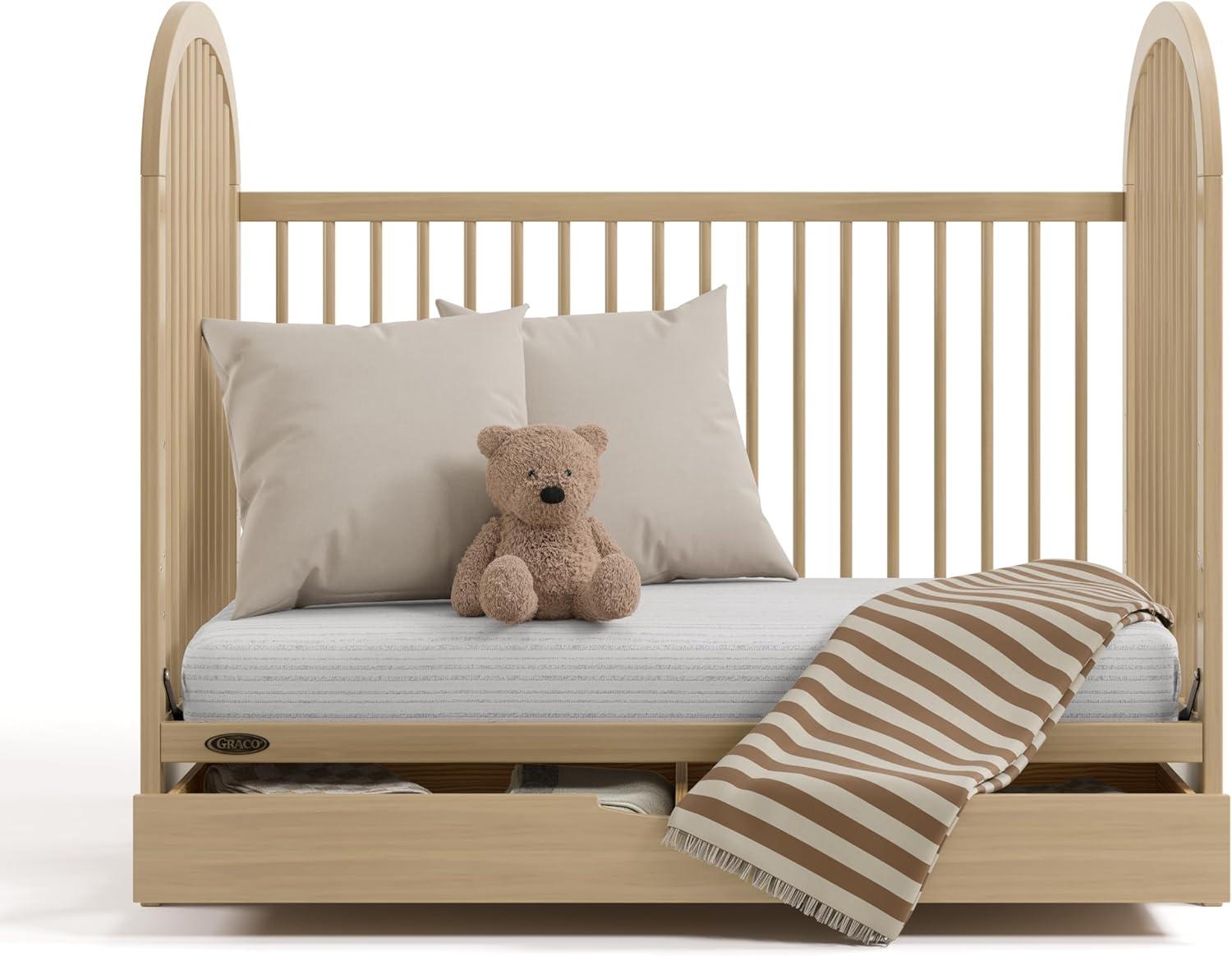 imageGraco Olivia Convertible Crib Hazelnut GREENGUARD Gold Certified 100 Solid Wood Fits Standard Crib Mattress Converts to Toddler Bed and Daybed 4 Adjustable Mattress HeightsDriftwood