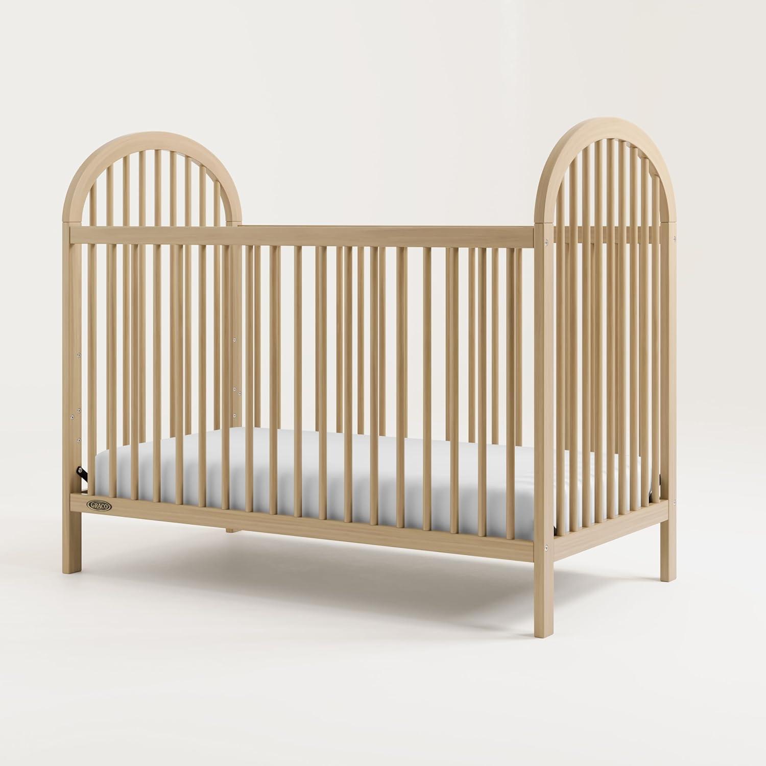 imageGraco Olivia Convertible Crib Hazelnut GREENGUARD Gold Certified 100 Solid Wood Fits Standard Crib Mattress Converts to Toddler Bed and Daybed 4 Adjustable Mattress HeightsDriftwood