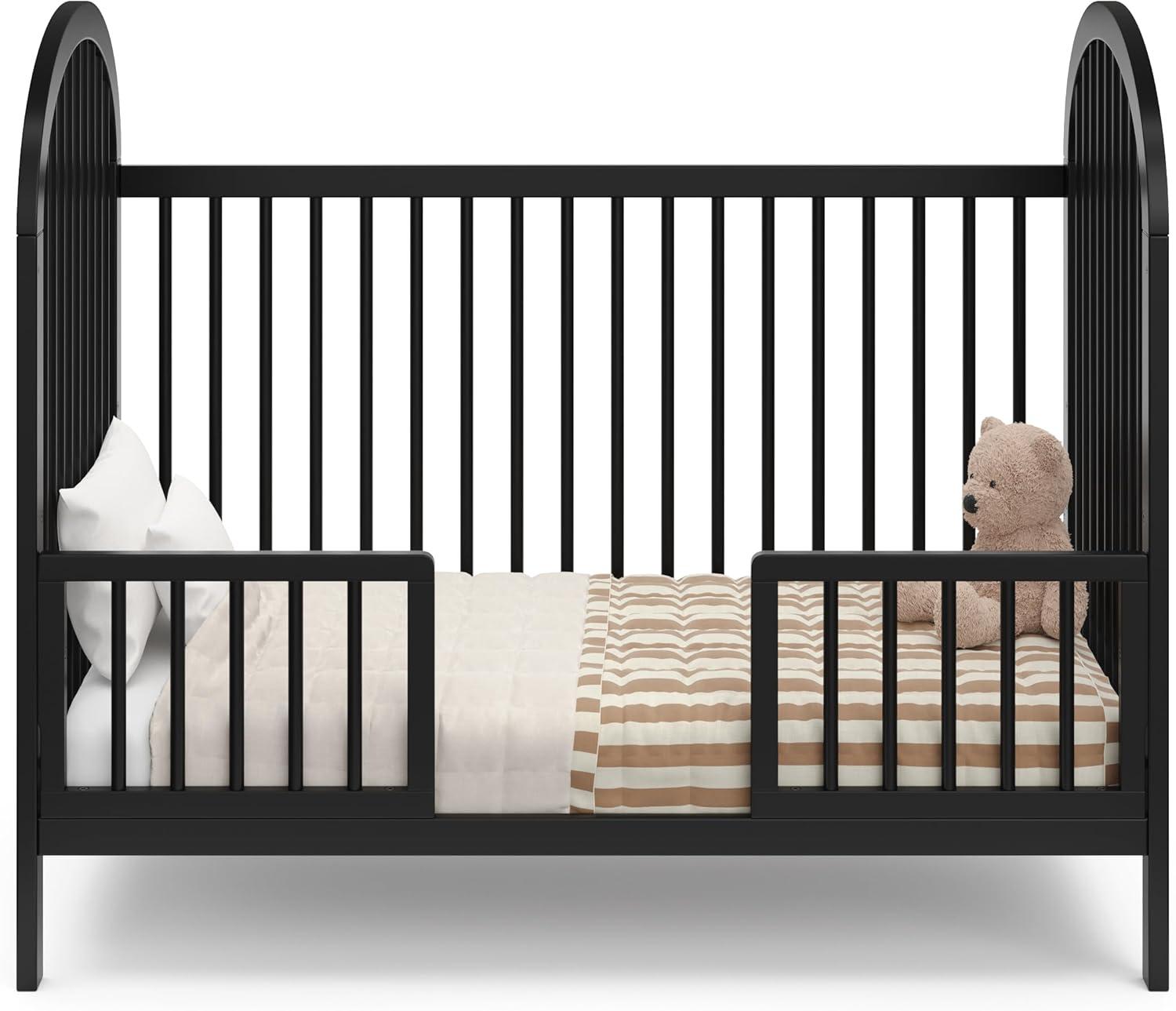 imageGraco Olivia Convertible Crib Hazelnut GREENGUARD Gold Certified 100 Solid Wood Fits Standard Crib Mattress Converts to Toddler Bed and Daybed 4 Adjustable Mattress HeightsBlack