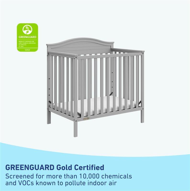 imageGraco Stella 4in1 Convertible Mini Crib with Bonus Mattress Pebble Gray Includes Bonus 275 Inch Thick Mattress with WaterResistant Cover Converts to Twin Bed Ideal Crib for Small SpacesPebble Gray