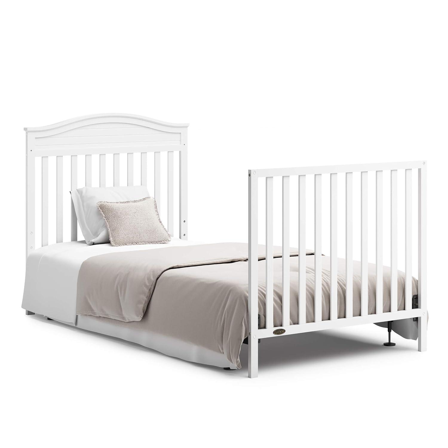 imageGraco Stella 4in1 Convertible Mini Crib with Bonus Mattress Pebble Gray Includes Bonus 275 Inch Thick Mattress with WaterResistant Cover Converts to Twin Bed Ideal Crib for Small SpacesWhite
