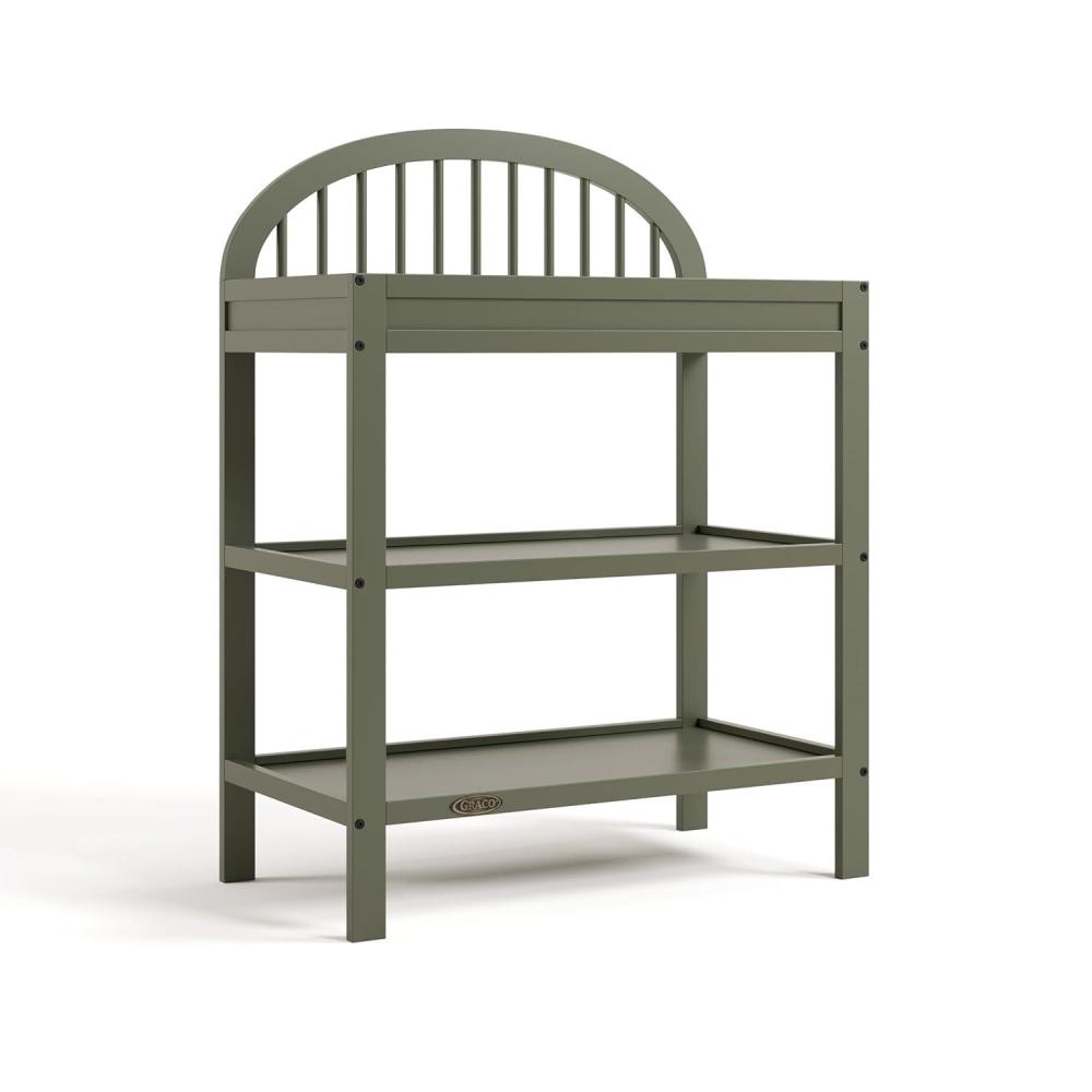imageGraco Olivia Changing Table with WaterResistant Changing Pad Driftwood GREENGUARD Gold Certified Includes Bonus WaterResistant Changing Pad with Safety Strap 2 Open Shelves Stylish DesignOlive