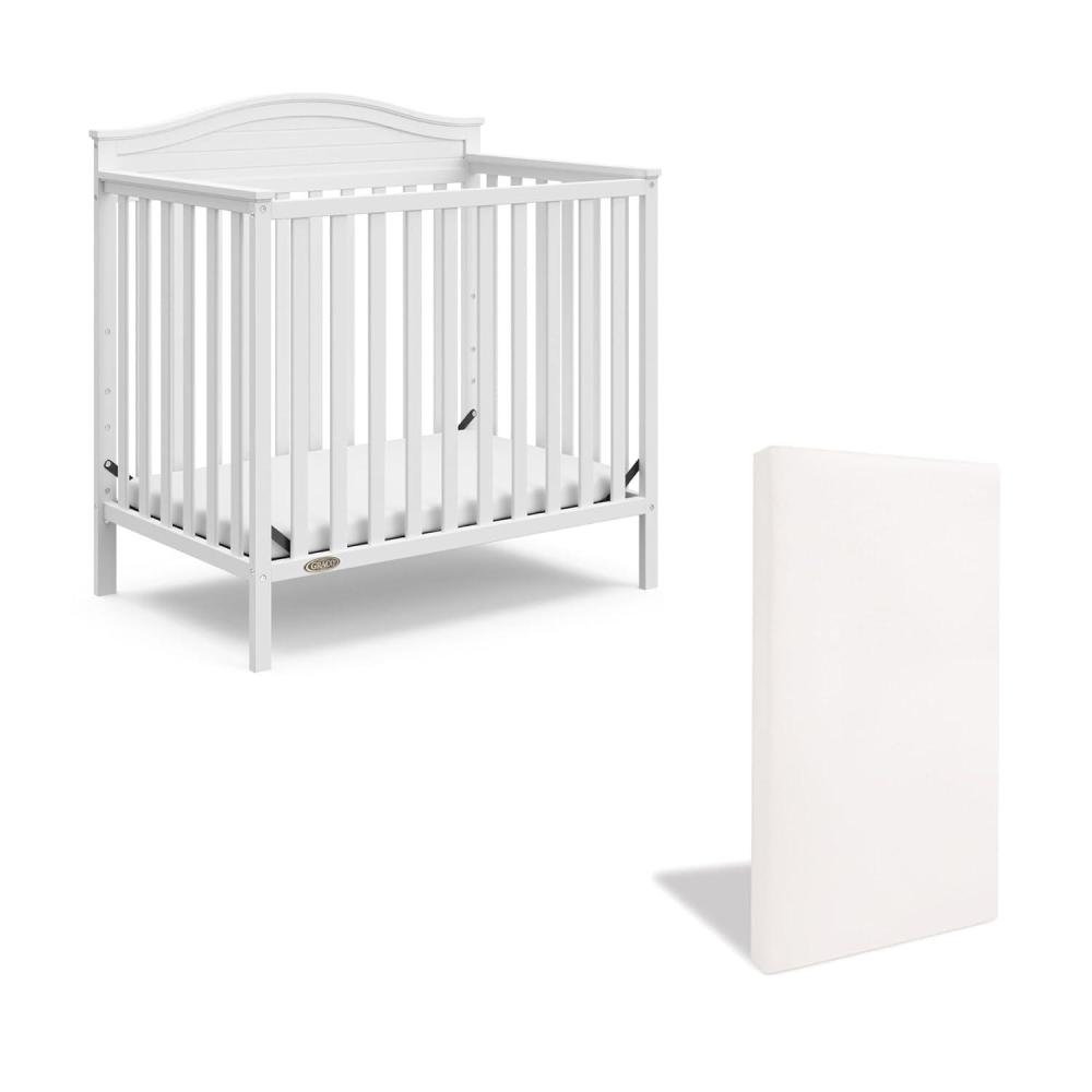 imageGraco Stella 4in1 Convertible Mini Crib with Bonus Mattress Pebble Gray Includes Bonus 275 Inch Thick Mattress with WaterResistant Cover Converts to Twin Bed Ideal Crib for Small SpacesWhite