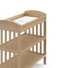 Graco Benton Changing Table with Bonus Water-Resistant Changing Pad (White) – GREENGUARD Gold Certified, Includes Diaper Change Pad with Safety Strap, 2 Open Storage Shelves for Organizing(Driftwood)