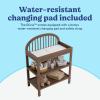 Graco Olivia Changing Table with Water-Resistant Changing Pad (Driftwood) – GREENGUARD Gold Certified, Includes Bonus Water-Resistant Changing Pad with Safety Strap, 2 Open Shelves, Stylish Design(Hazelnut)