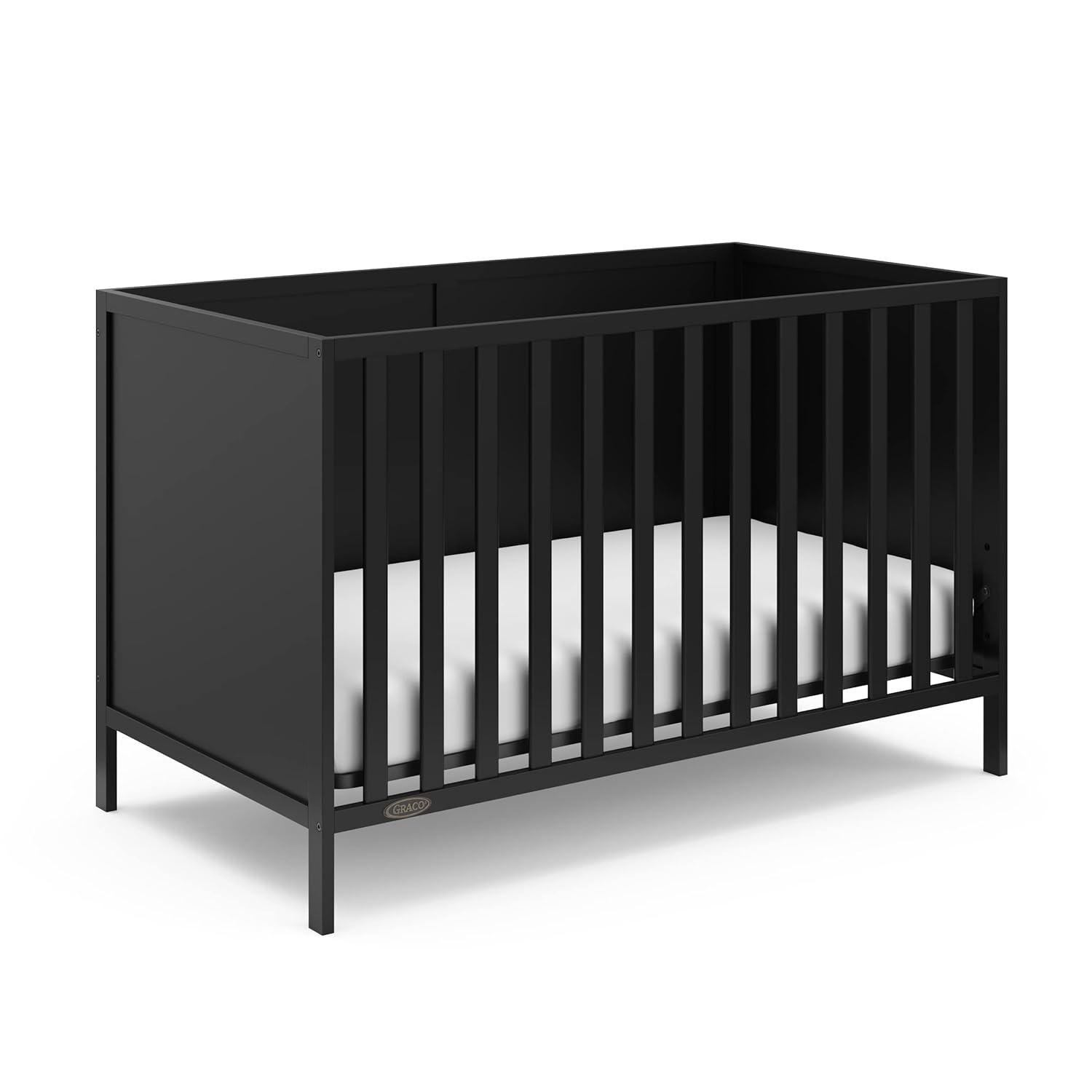 imageGraco Theo Convertible Crib with Storage Drawer Frosted Oat GREENGUARD Gold Certified Wooden Baby Crib with Drawer Converts to Toddler Bed Fits Standard Crib MattressBlack