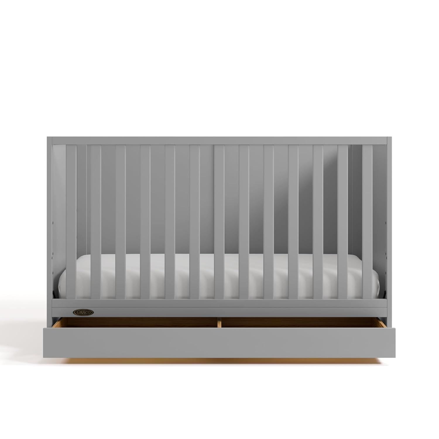 imageGraco Theo Convertible Crib with Storage Drawer Frosted Oat GREENGUARD Gold Certified Wooden Baby Crib with Drawer Converts to Toddler Bed Fits Standard Crib MattressPebble Gray