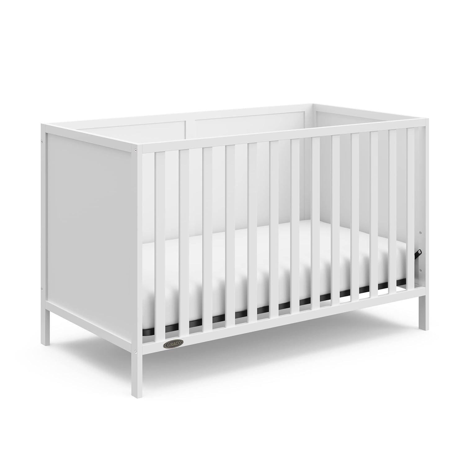 imageGraco Theo Convertible Crib with Storage Drawer Frosted Oat GREENGUARD Gold Certified Wooden Baby Crib with Drawer Converts to Toddler Bed Fits Standard Crib MattressWhite