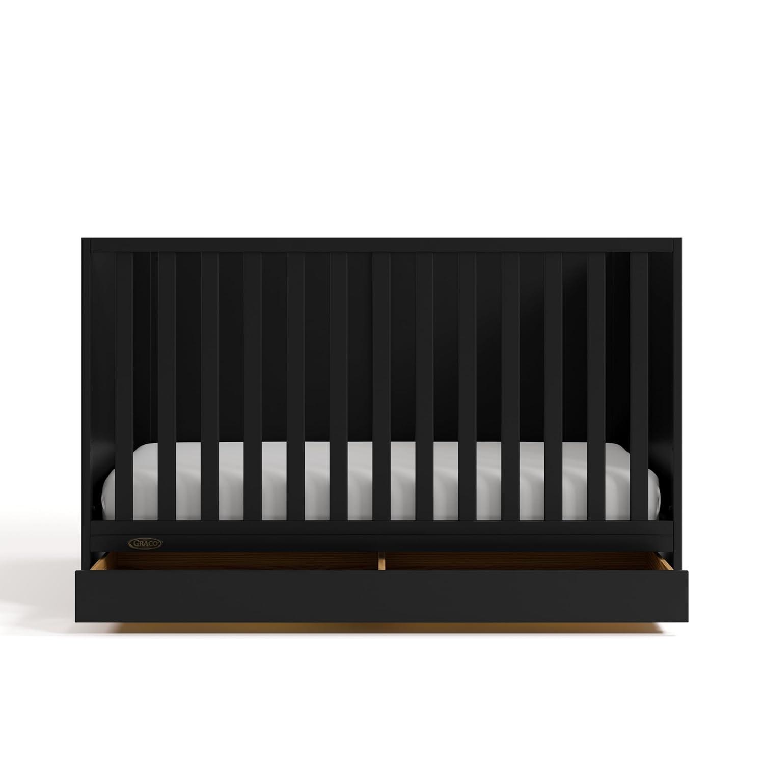 imageGraco Theo Convertible Crib with Storage Drawer Frosted Oat GREENGUARD Gold Certified Wooden Baby Crib with Drawer Converts to Toddler Bed Fits Standard Crib MattressBlack