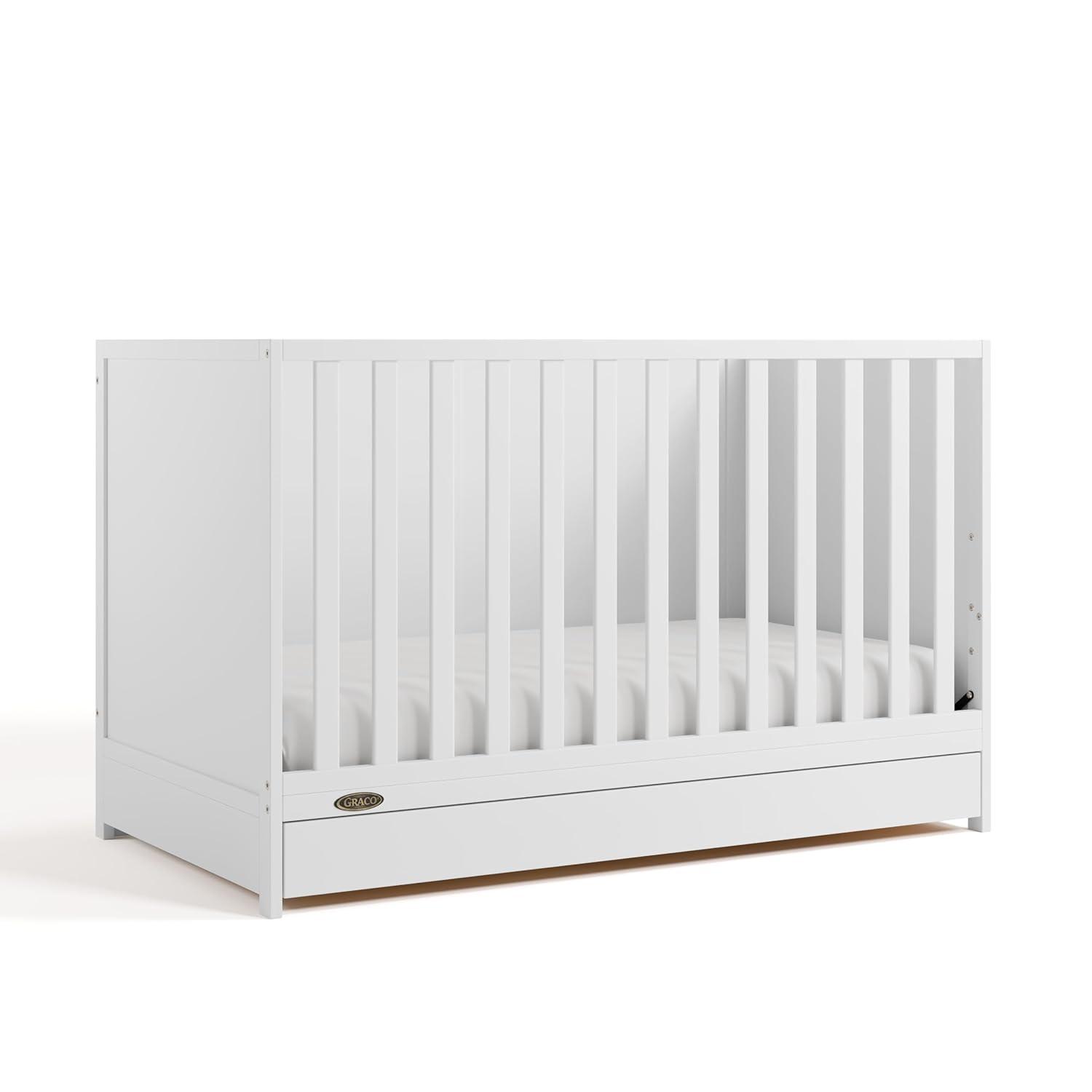 imageGraco Theo Convertible Crib with Storage Drawer Frosted Oat GREENGUARD Gold Certified Wooden Baby Crib with Drawer Converts to Toddler Bed Fits Standard Crib MattressWhite