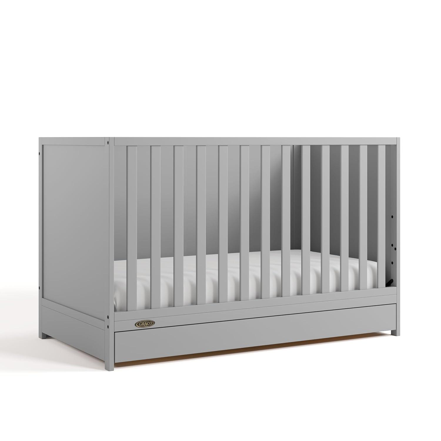imageGraco Theo Convertible Crib with Storage Drawer Frosted Oat GREENGUARD Gold Certified Wooden Baby Crib with Drawer Converts to Toddler Bed Fits Standard Crib MattressPebble Gray