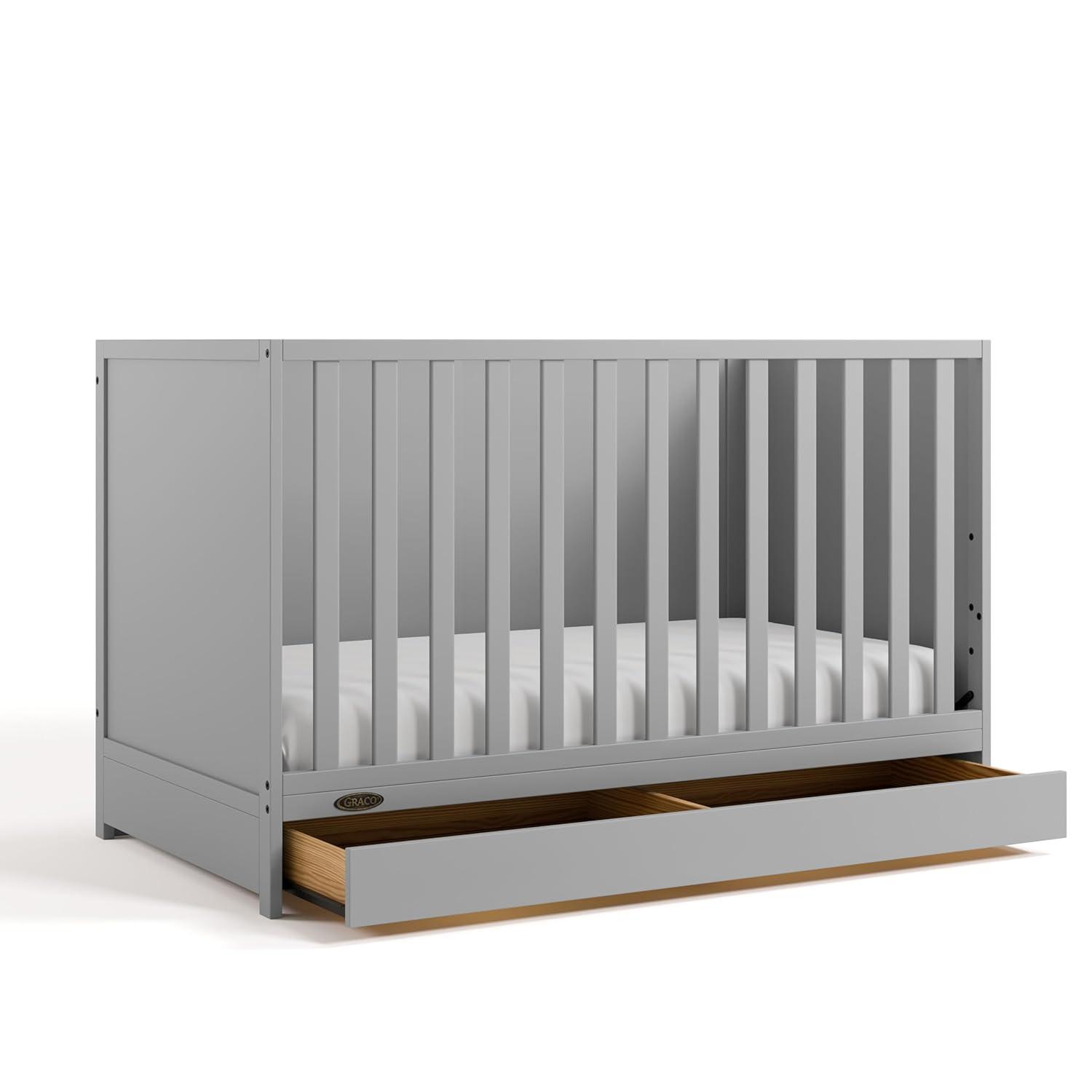 imageGraco Theo Convertible Crib with Storage Drawer Frosted Oat GREENGUARD Gold Certified Wooden Baby Crib with Drawer Converts to Toddler Bed Fits Standard Crib MattressPebble Gray
